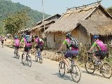 cycling past a village